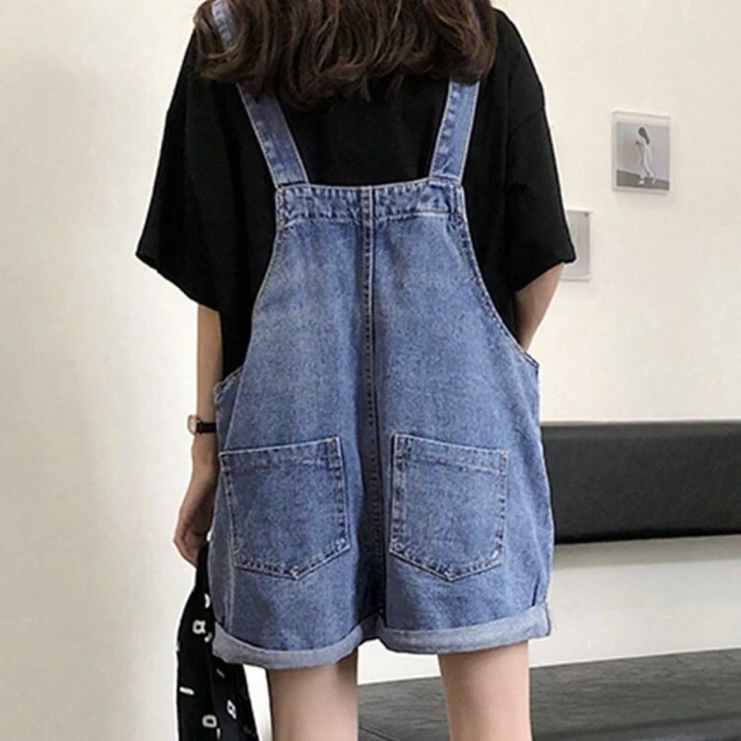 Blue denim overall shorts with front pockets (Category: Jumpsuits) located in General Trias. Submitted by dearsunnyshine (Listing ID 1470005964, Image 3). Description: - Style: Casual blue denim overall shorts - Fit: Relaxed, loose fit - Features: Adjustable shoulder straps, cuffed hems, and two large front pockets - Perfect for: Warm weather daily wear - Condition: Good as new.
