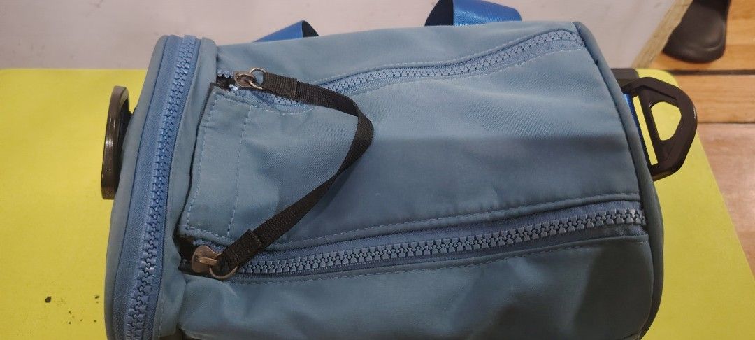 Blue Duffle Bag Gym Bag with Removable Strap (Category: Sling Bags) located in Manila. Submitted by declutter_bae (Listing ID 1470106569, Image 2). Description: - Color: Blue with bright blue handles and strap - Design: Large white 'BG' and 'MG' text print - Hardware: Chunky blue zippers all around - Compartments: Includes an inner zipper pocket, mesh compartments, and a convenient side zipped pocket for quick access - Condition: Clean interior l