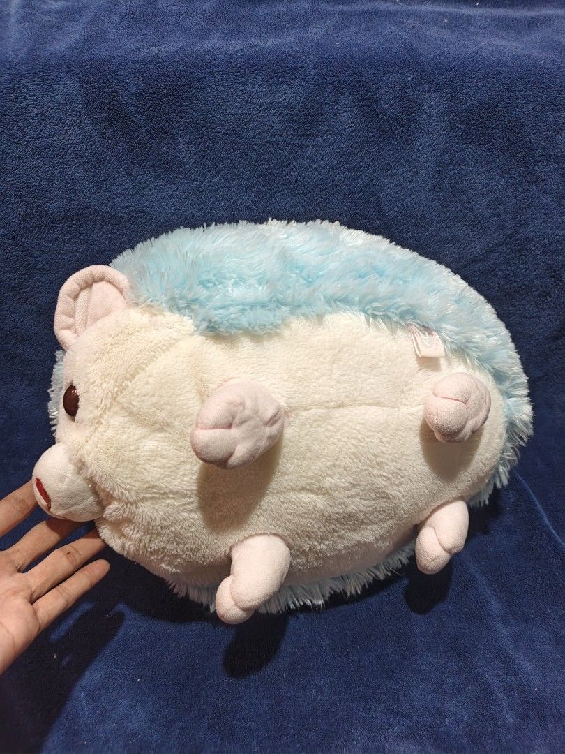 Blue Hedgehog Plush Stuffed Toy (Category: Plushies & Soft Toys) located in Manila. Submitted by kirstentoyshub (Listing ID 1470016274, Image 3). Description: - Adorable blue and white hedgehog plush toy - Super soft, squishy, and huggable texture - Features large brown eyes, pink nose, and cute paw details - Unique star patch design on the back - Excellent and clean condition (no tears or stains) - Perfect for gifts, kids, or plushie collectors.