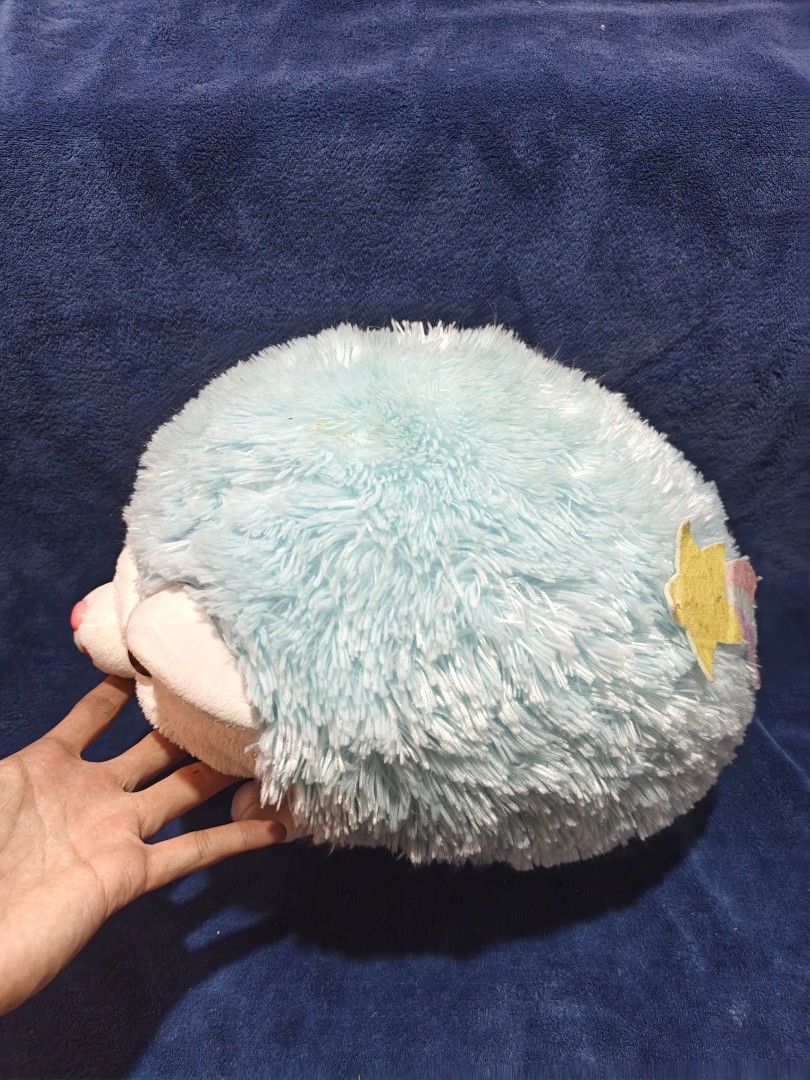 Blue Hedgehog Plush Stuffed Toy (Category: Plushies & Soft Toys) located in Manila. Submitted by kirstentoyshub (Listing ID 1470016274, Image 2). Description: - Adorable blue and white hedgehog plush toy - Super soft, squishy, and huggable texture - Features large brown eyes, pink nose, and cute paw details - Unique star patch design on the back - Excellent and clean condition (no tears or stains) - Perfect for gifts, kids, or plushie collectors.