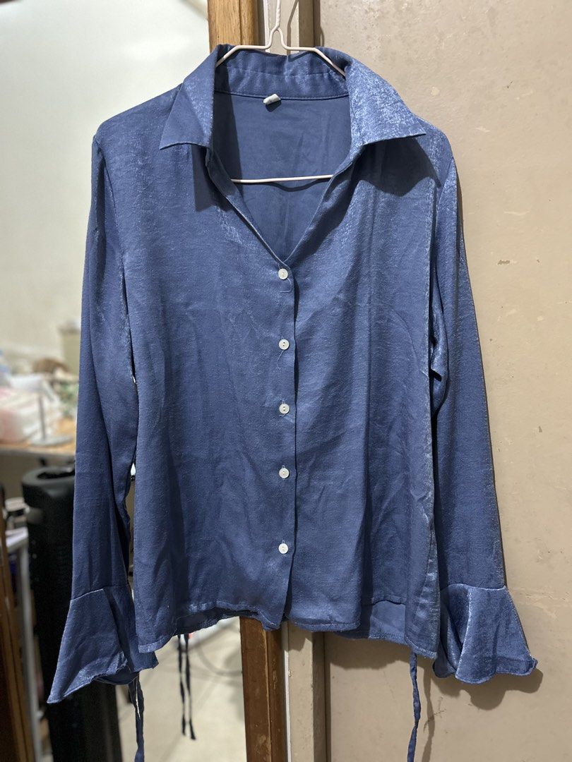 Blue satin button-down long sleeve blouse with flare cuffs (Category: Longsleeves) located in Manila. Submitted by prelovedbyeljodi (Listing ID 1470010671, Image 2). Description: ✨ **Longsleeves for Sale!** ✨ 👗 Lightly used and still in great condition! 📌 **RFS:** Decluttering 💌 Message me if interested! .