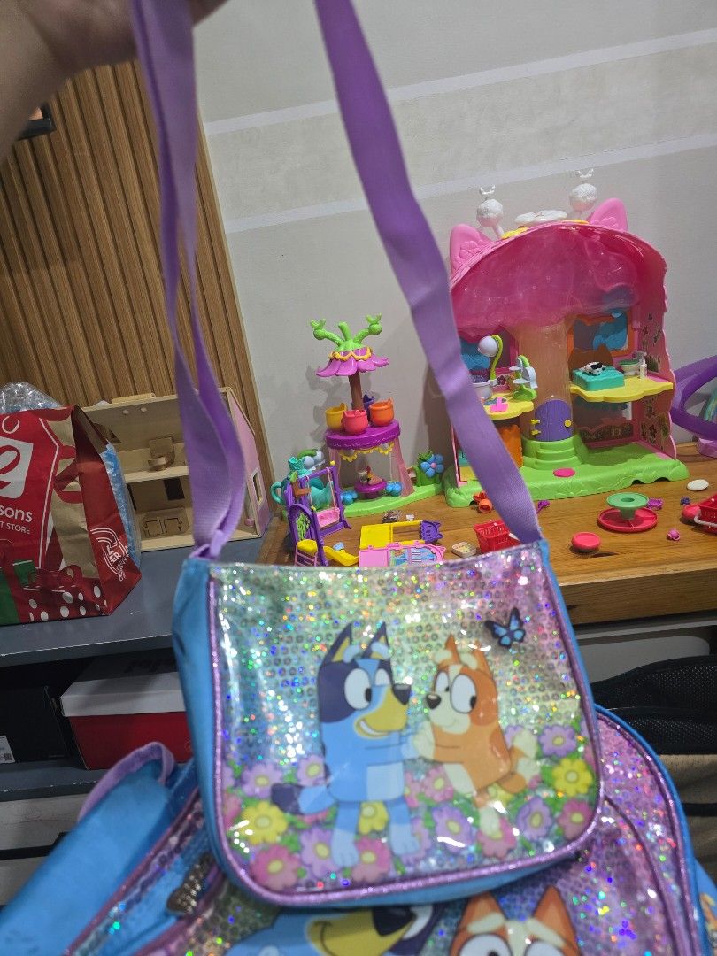 Bluey Backpack and Bluetooth Wireless Headphones Set (Category: Headphones & Headsets) located in Imus. Submitted by chie0308 (Listing ID 1470131055, Image 2). Description: - Official Bluey merchandise bundle perfect for young fans - Sparkly backpack featuring a glittery front pocket with Bluey and Bingo graphics and an all-over character print - Wireless headphones equipped with plush ear cups and cute Bluey ears on the headband - Built-in volum