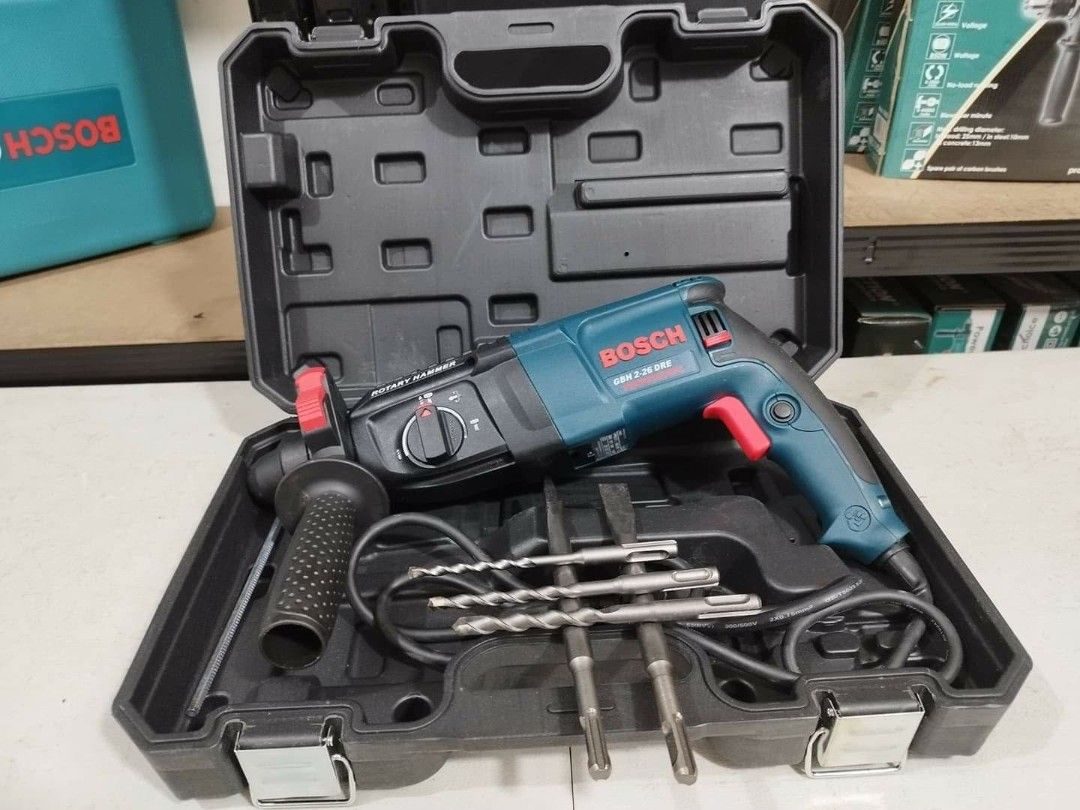 Bosch GBH 2-26 DRE Rotary Hammer Drill Set (Category: Construction Tools & Equipment) located in Valenzuela. Submitted by mysticgem.f63ae6 (Listing ID 1469955941, Image 2). Description: - Model: Bosch GBH 2-26 DRE Rotary Hammer Drill - Condition: Clean body with minimal wear, excellent working condition - Power: Heavy-duty corded motor for tough drilling and chiseling jobs - Inclusions: Auxiliary handle, depth gauge, 2 chisels, and 3 drill bits -