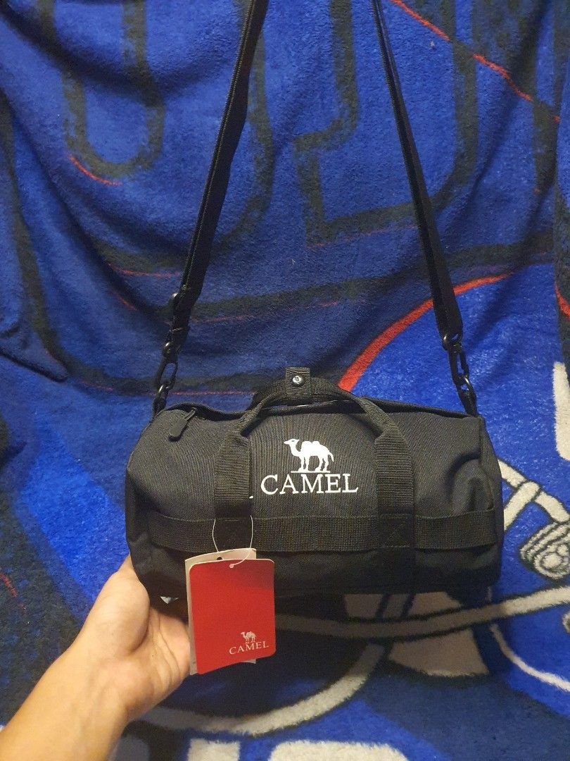 Brand new Vintage Camel mini duffle bag (Category: Sling Bags) located in San Fernando. Submitted by retro.district. (Listing ID 1470133139, Image 2). Description: - Brand: Camell Marlboroo - Color: Black - Type: Duffle Bag - Features: Shoulder strap included - Condition: Brand new with tags attached - Ideal for: Carrying essentials.