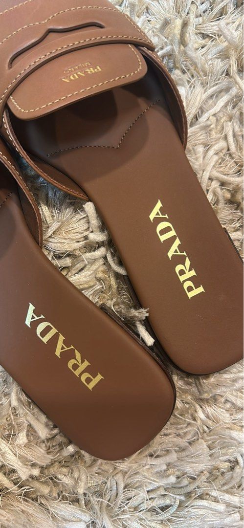 BRAND NEW PRADA MILANO SANDALS (Category: Sneakers & Footwear) located in Makati City. Submitted by pennepatootiepie (Listing ID 1469995738, Image 3). Description: Brand New Never Used Prada Milano Leather Sandals in Chocolate Brown Size 37 Comes with Prada Milano Box, Prada Cards and Prada Paper Bag. Original Price: 59,000 Php Selling Price: 40,000 Php Price negotiable .