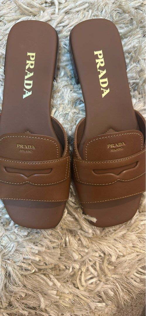 BRAND NEW PRADA MILANO SANDALS (Category: Sneakers & Footwear) located in Makati City. Submitted by pennepatootiepie (Listing ID 1469995738, Image 2). Description: Brand New Never Used Prada Milano Leather Sandals in Chocolate Brown Size 37 Comes with Prada Milano Box, Prada Cards and Prada Paper Bag. Original Price: 59,000 Php Selling Price: 40,000 Php Price negotiable .