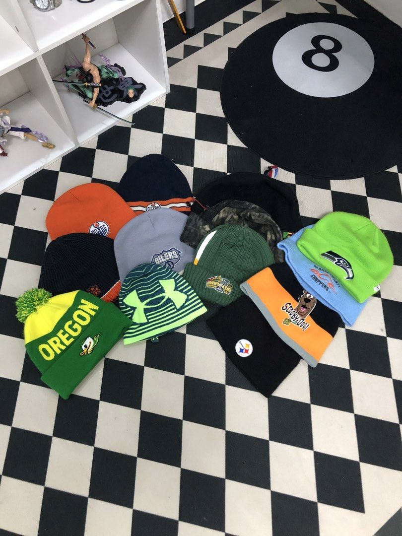 Branded Affordable Beanies🇨🇦🔥 (Category: Caps & Hats) located in Manila. Submitted by ejaay_2012 (Listing ID 1470102554, Image 1). Description: - Collection of cozy winter beanies featuring sports teams and fun characters - Sports teams include: Edmonton Oilers, Pittsburgh Steelers, Seattle Seahawks, and Oregon Ducks - Fun character designs available, including Scooby Doo - Styles include cuffed and pompom knit hats in various colors - Perfect