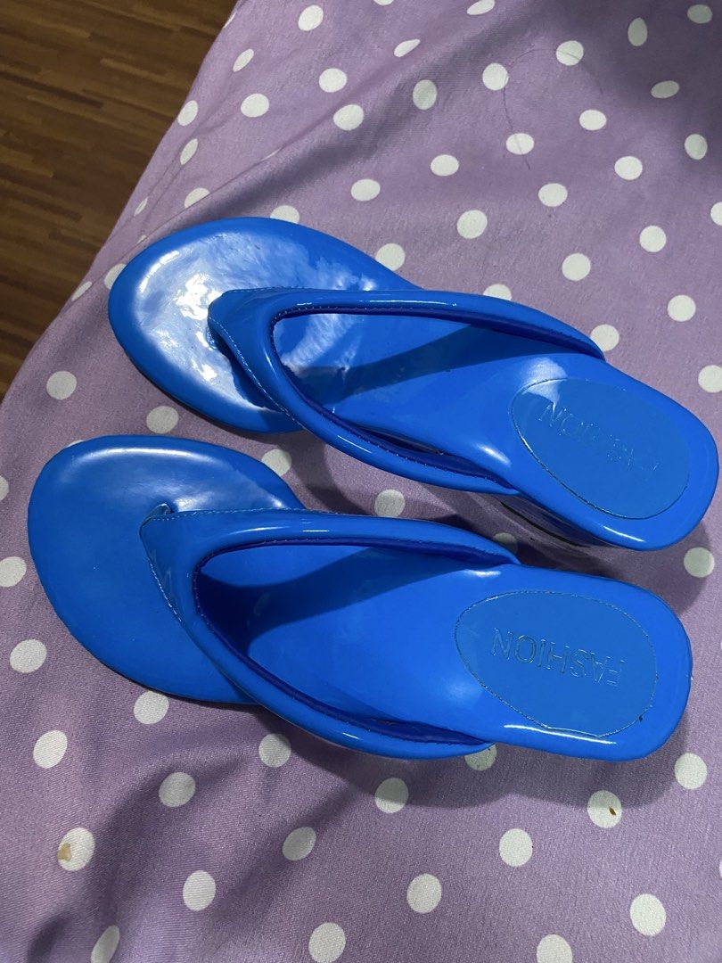 Bright Blue Wedge Thong Sandals (Category: Wedges) located in Guinobatan. Submitted by whtvrim (Listing ID 1469986809, Image 1). Description: - Color: Bright blue with a glossy finish - Style: Thong strap wedge sandals - Condition: Worn once, soles show barely any wear - Comfort: Adds a bit of height while keeping feet comfortable - Perfect for: Adding a vibrant pop of color to sunny day outfits.