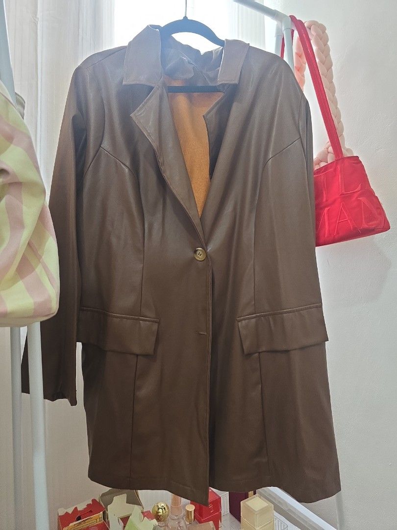 Brown Leather Coat with Yellow Lining (Category: Coats, Jackets and Outerwear) located in Manila. Submitted by cee_gotaway6991 (Listing ID 1469959158, Image 2). Description: - Features a striking bright yellow inner lining for a pop of color - Classic front button closure and practical front flap pockets - Structured collar and long sleeves for a polished look - Ideal outerwear piece to keep you warm during cooler weather.