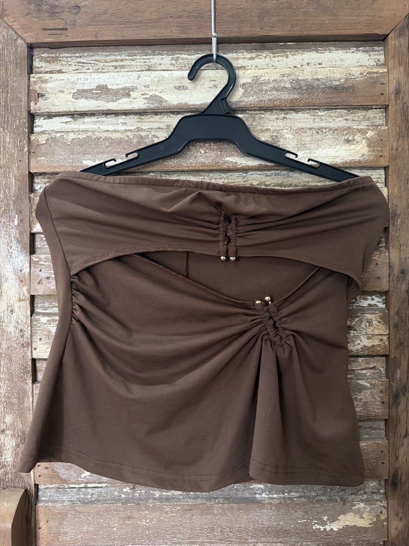 Brown Tube Top with Cutout and Drawstring Details (Category: Sleeveless) located in Manila. Submitted by cb_____ (Listing ID 1469969021, Image 1). Description: - Trendy brown strapless tube top - Features a chic cutout design right below the neckline - Ruched fabric accented with small gold-toned beads at the center and sides - Soft and stretchy material for an ultra-comfortable fit - Simple back with a vertical center seam - Versatile piece, gre