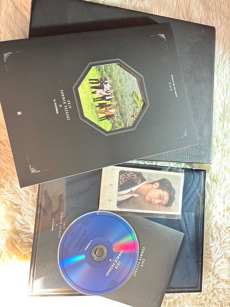 BTS 2019 Summer Package in Korea (Category: K-Wave Merchandise) located in Manila. Submitted by ladyoflight (Listing ID 1470101184, Image 2). Description: - Official BTS 2019 Summer Package (Black edition) - Includes outer box and photobook - Comes with RM photocard - Includes DVD disc - Perfect addition to your ARMY collection - What you see is what you get.