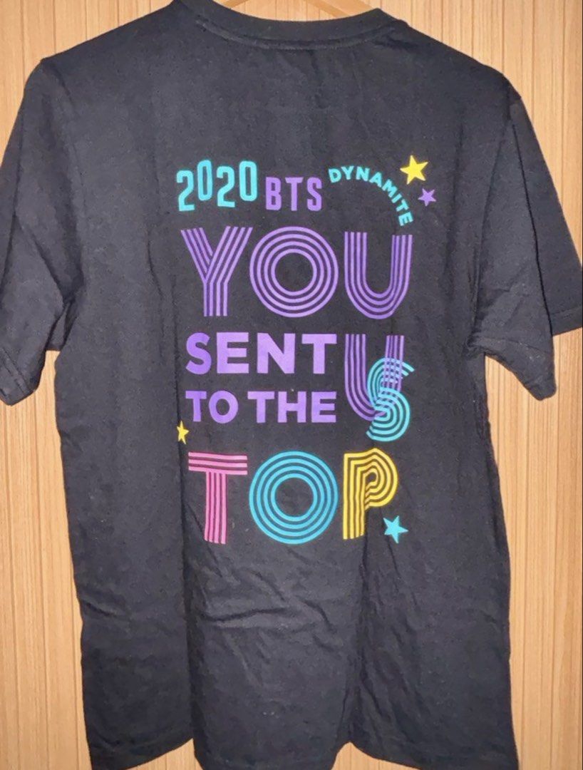 BTS Dynamite S/S Tee 03 Black Size M (Category: Shirts) located in Quezon City. Submitted by chichubph_ (Listing ID 1470035888, Image 2). Description: - Official BTS Dynamite merchandise in Size M - Brand new, unworn, and straight from packaging - Original Big Hit Entertainment tags still attached - 100% premium cotton material for comfort - Features a small Dynamite logo on the front chest - Large, colourful '2020 BTS You Sent Us To The Top' gra
