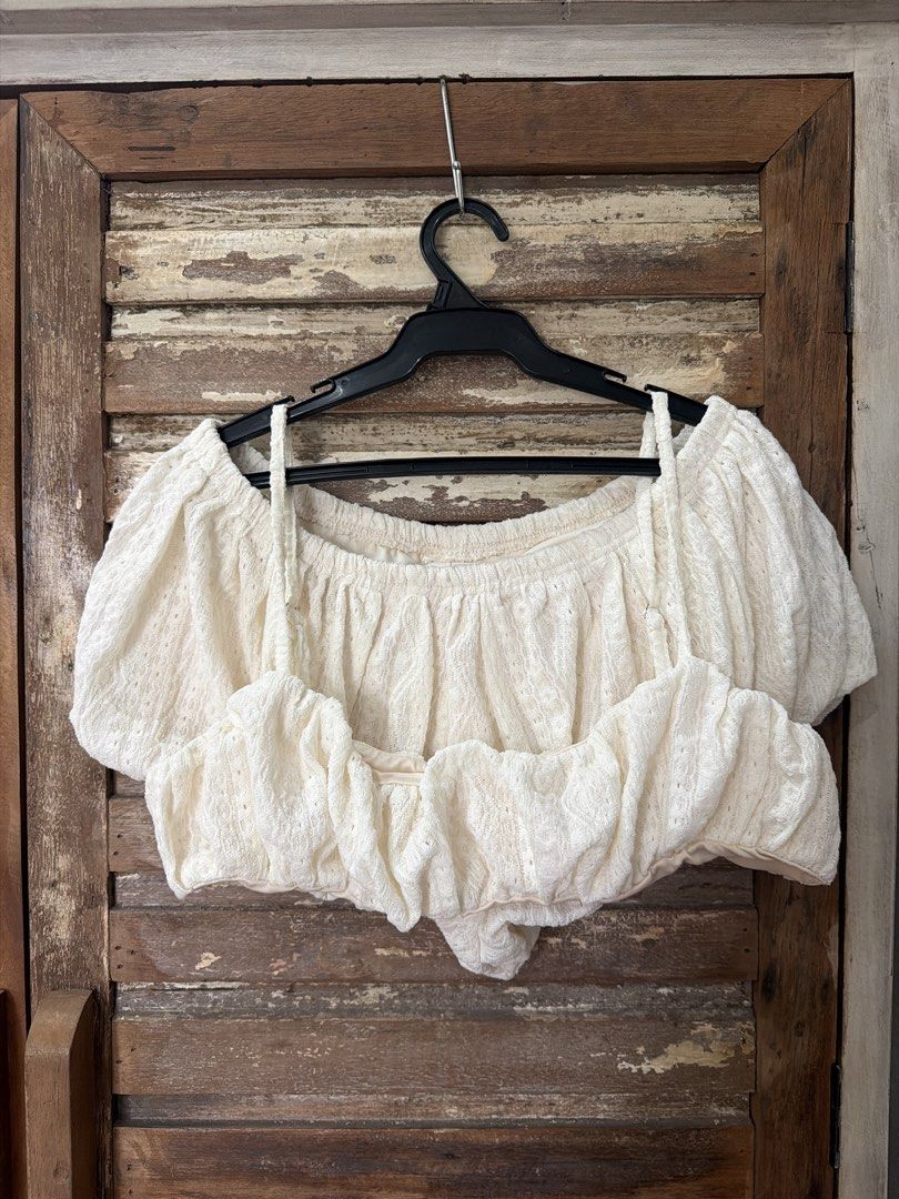 Bubble short and bralette set (Category: Sets or Coordinates) located in Manila. Submitted by cb_____ (Listing ID 1469969318, Image 1). Description: - Style: Cute cottagecore two-piece set - Design: Strappy crop top base with an off-shoulder ruffled overlay - Material: White textured fabric with a subtle all-over pattern - Fit: Snug and secure with an elasticated top edge - Pairing: Great with denim shorts or midi skirts for sunny days.