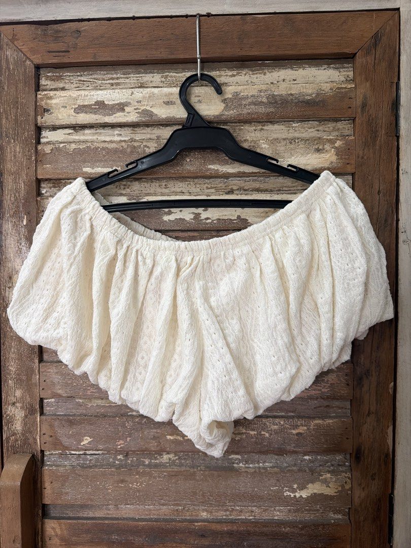 Bubble short and bralette set (Category: Sets or Coordinates) located in Manila. Submitted by cb_____ (Listing ID 1469969318, Image 3). Description: - Style: Cute cottagecore two-piece set - Design: Strappy crop top base with an off-shoulder ruffled overlay - Material: White textured fabric with a subtle all-over pattern - Fit: Snug and secure with an elasticated top edge - Pairing: Great with denim shorts or midi skirts for sunny days.