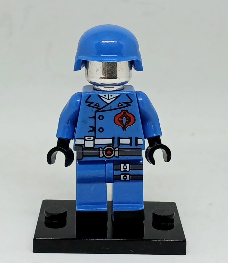 Custom Building Blocks G.I. Joe COBRA COMMANDER minifigure (Category: Lego & Building Sets) located in Manila. Submitted by brunobeaut55620 (Listing ID 1470000355, Image 1). Description: - Custom building blocks.G.I. Joe COBRA COMMANDER minifigure in factory-sealed clear packaging - Metallic silver head underneath a detachable blue helmet - Detailed uniform with the classic red snake logo on the chest - Equipped with a detailed belt and tactical 