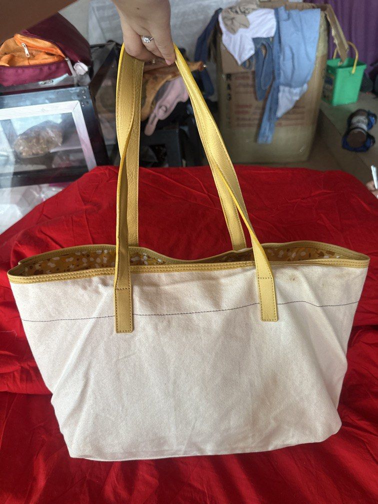 Burberry Blue Label (Category: Tote Bags) located in Caloocan City. Submitted by hariel_beverly_onlineshop (Listing ID 1470018850, Image 2). Description: Burberry Blue Label Canvas Stowell Tote Bag with yellow leather trim. Burberry Blue Label was an exclusive, licensed sub-brand produced for the Japanese market, renowned for its casual aesthetic, durable canvas material constructions, and minimalist plate branding..