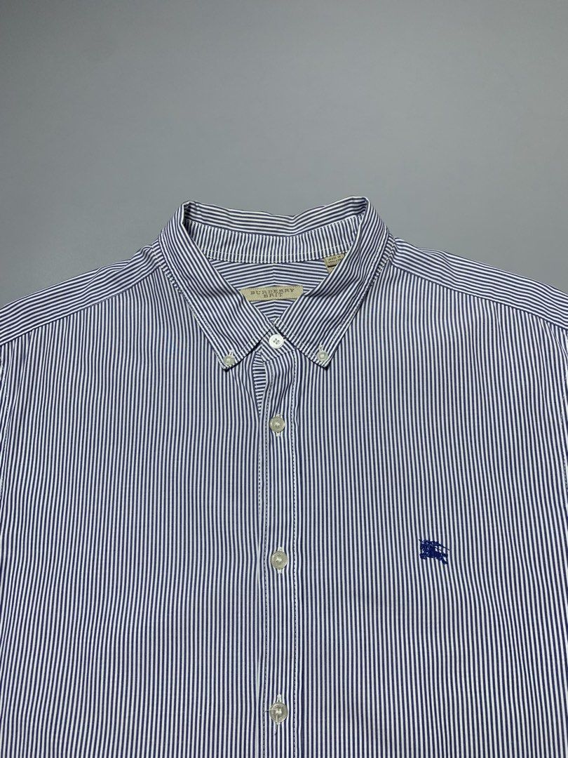 Burberry Brit Stripe Button Down Polo Long sleeve (Category: Luxury Apparel) located in Manila. Submitted by macadr1p (Listing ID 1470113765, Image 2). Description: Burberry Brit 𝑴𝒆𝒂𝒔𝒖𝒓𝒆𝒎𝒆𝒏𝒕𝒔 — 22x30 𝑩𝒆𝒔𝒕 𝑭𝒊𝒕 — XL 𝑪𝒐𝒍𝒐𝒓 𝑹𝒂𝒕𝒆— 10/10 𝑪𝒐𝒏𝒅𝒊𝒕𝒊𝒐𝒏 — Like New 𝑻𝒂𝒈𝒔 — No washtag 𝑰𝒔𝒔𝒖𝒆𝒔 — None 𝑭𝒂𝒃𝒓𝒊𝒄 — High-quality 𝑪𝒐𝒍𝒐𝒓 — Not faded 𝑺𝒊𝒈𝒏𝒔 𝒐𝒇 𝑼𝒔𝒂𝒈𝒆 — None 𝑫𝑰𝑺𝑪𝑳𝑨𝑰𝑴𝑬𝑹❗️ 𝑨𝒍𝒍 𝒑�