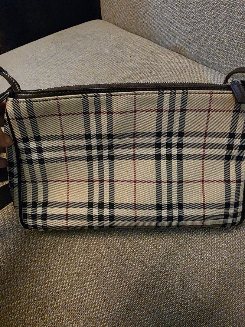 Burberry Check Crossbody Bag (Category: Luxury Bags & Wallets) located in Pasig City. Submitted by starfjames (Listing ID 1469980458, Image 2). Description: Pre-loved authentic Burberry crossbody bag for only P12K! Grab this rare great deal now! Nice, good condition. Exterior large slip pocket, zip main compartment, 1 interior zip pocket, 1 interior slip pocket, lined interior with Burberry markings. Approx. dimensions: 11 x 7 x 2 inches. .
