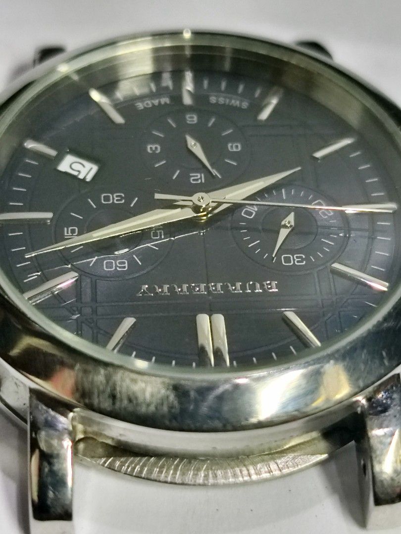 Burberry Heritage BU1360 Chronograph Watch (Category: Luxury Watches) located in Caloocan City. Submitted by watch-orig (Listing ID 1470103241, Image 3). Description: - Model: Burberry Heritage BU1360 Chronograph Watch - Dial: Dark blue textured dial with 3 sub-dials and date window at 4 o'clock - Movement: Swiss-made movement - Case: Stainless steel case (Head only, strap is missing) - Condition: Minor surface scratches on the bezel from normal 
