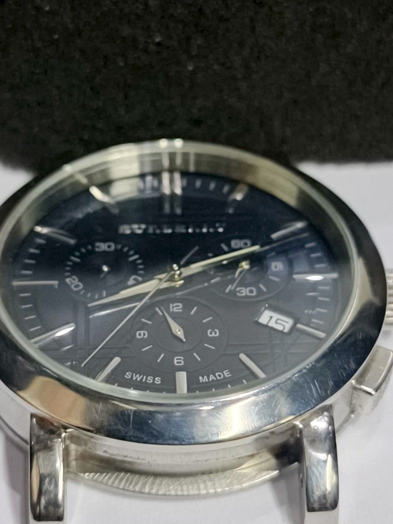 Burberry Heritage BU1360 Chronograph Watch (Category: Luxury Watches) located in Caloocan City. Submitted by watch-orig (Listing ID 1470103241, Image 2). Description: - Model: Burberry Heritage BU1360 Chronograph Watch - Dial: Dark blue textured dial with 3 sub-dials and date window at 4 o'clock - Movement: Swiss-made movement - Case: Stainless steel case (Head only, strap is missing) - Condition: Minor surface scratches on the bezel from normal 