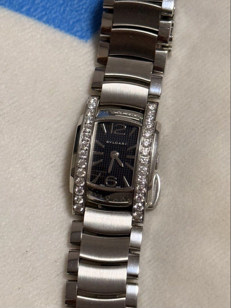 Bvlgari Assioma Diamond Watch AA 26 S (Category: Women's Watches) located in Makati City. Submitted by aeboi08 (Listing ID 1469950271, Image 1). Description: - Brand/Model: Bvlgari Assioma (AA 26 S) - Serial Number: L 3539 - Material: Stainless steel case and bracelet - Bezel: Diamond-set on the sides - Dial: Dark textured dial with Arabic numerals at 6 and 12 - Movement: Swiss quartz movement - Case Back: Engraved details secured by four screws 