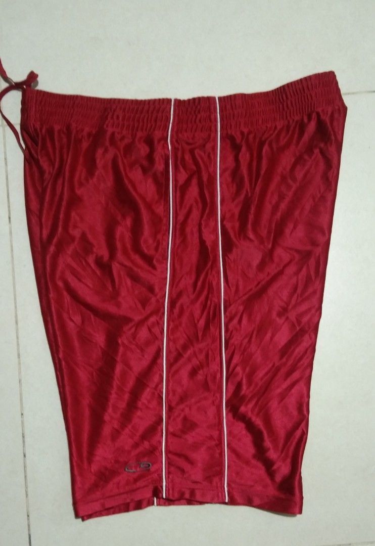 C9 by Champion Red Athletic Shorts XL (Category: Shorts) located in Manila. Submitted by aj.bermundo (Listing ID 1470020239, Image 2). Description: - Brand: C9 by Champion - Size: XL - Color: Red with white piping details - Material: Shiny polyester - Waistband: Elastic with inner drawstring - Features: Embroidered C9 logo near the bottom hem - Origin: Made in the Philippines.