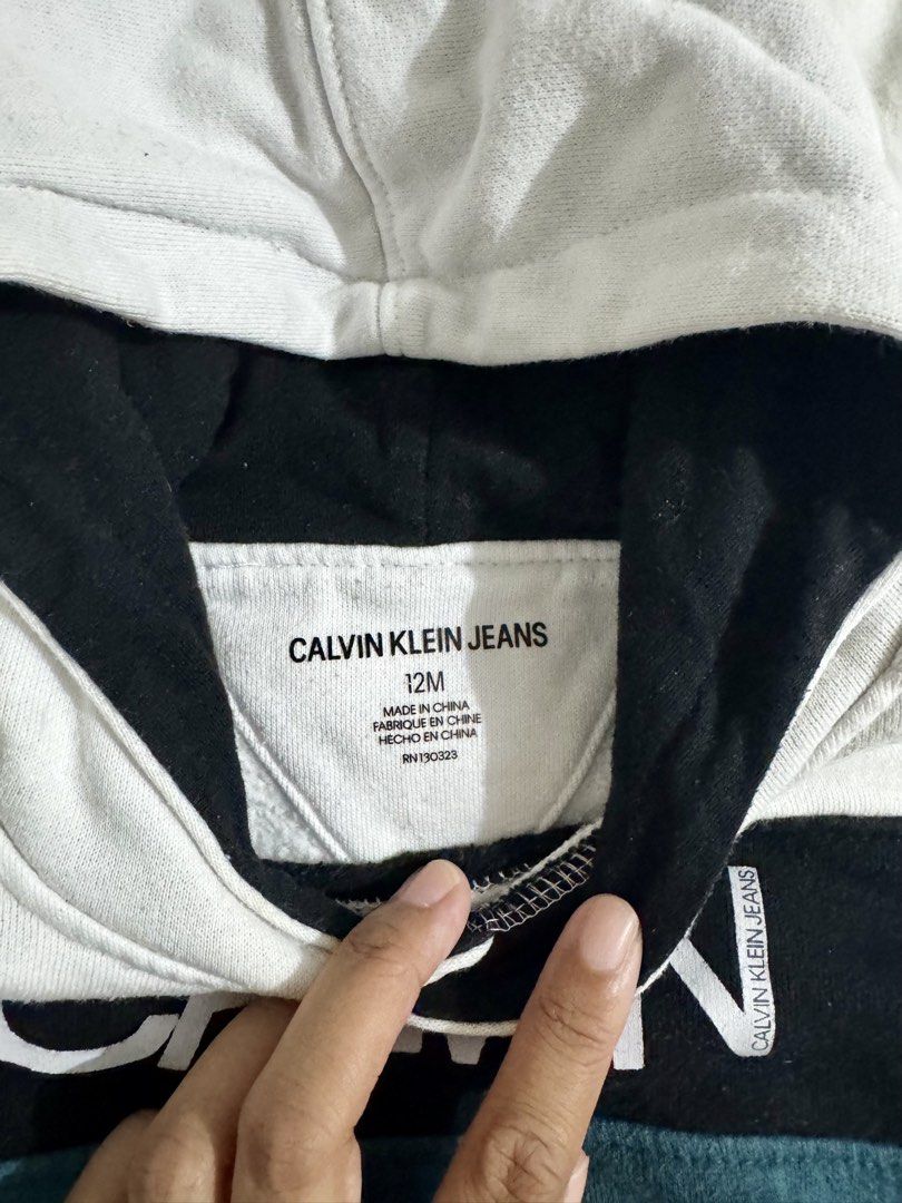 Baby Hoodie (Category: Babies & Kids Fashion) located in Paranaque City. Submitted by april_anythingpreloved (Listing ID 1470082746, Image 2). Description: - Brand: Calvin Klein Jeans - Size on tag: 12M (My son wore this until 3 yrs old) -Bought in the US -RFS: Decluttering - Location: Paranaque .