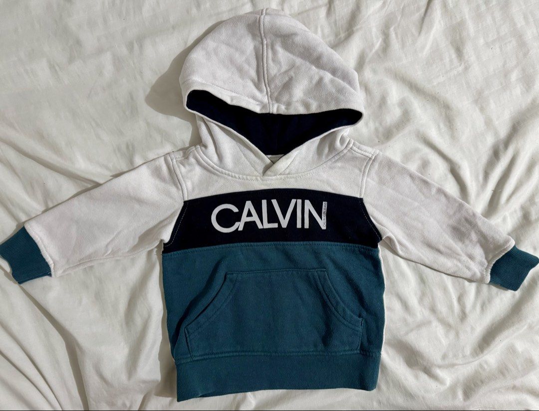 Baby Hoodie (Category: Babies & Kids Fashion) located in Paranaque City. Submitted by april_anythingpreloved (Listing ID 1470082746, Image 1). Description: - Brand: Calvin Klein Jeans - Size on tag: 12M (My son wore this until 3 yrs old) -Bought in the US -RFS: Decluttering - Location: Paranaque .