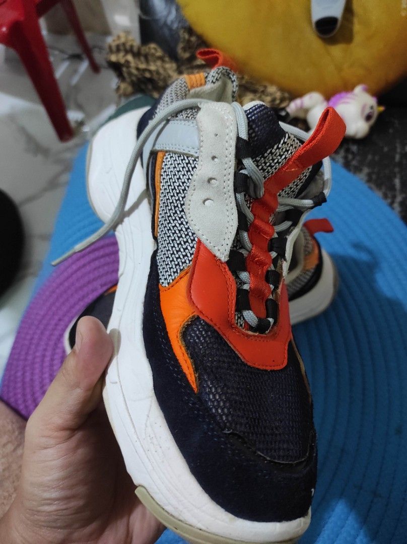 Calvin Klein Jeans Chunky Sneakers Multi-color (Category: Sneakers) located in Quezon City. Submitted by adibagtas (Listing ID 1469955338, Image 2). Description: - Brand: Calvin Klein Jeans - Style: Chunky sneakers with a bold black, orange, grey, and white colorway - Soles: Chunky white rubber sole with good grip (minor wear) - Upper: Textured mesh panels for breathability - Condition: Solid daily kicks, includes laces - Perfect for daily wear a