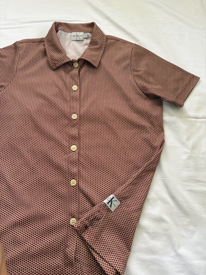 Calvin Klein Jeans Top (Category: Shirts) located in Muntinlupa City. Submitted by jane226ph (Listing ID 1470134664, Image 2). Description: Original Button up shirt Color Red Lightweight Purchased in-store Sold as-is.