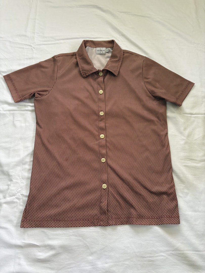 Calvin Klein Jeans Top (Category: Shirts) located in Muntinlupa City. Submitted by jane226ph (Listing ID 1470134664, Image 1). Description: Original Button up shirt Color Red Lightweight Purchased in-store Sold as-is.