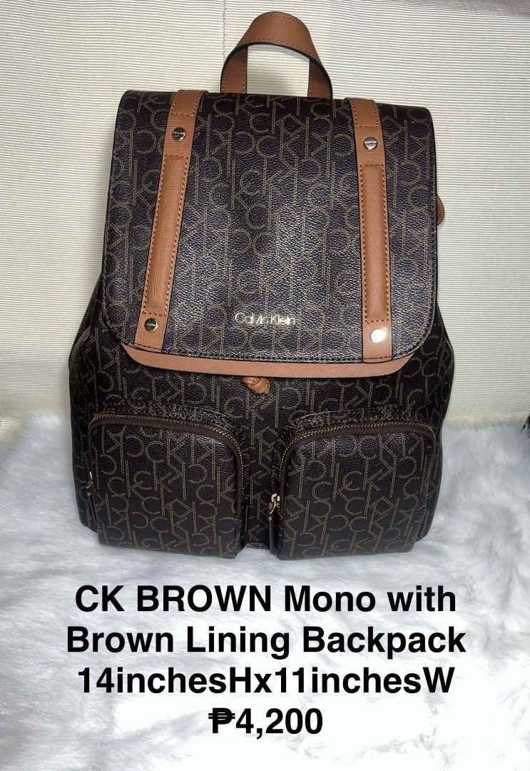 Calvin Klein Unisex Brown Mono Backpack (Category: Backpacks) located in Imus. Submitted by maria_pilayo (Listing ID 1469972025, Image 1). Description: - Brand: Calvin Klein - 💯% Authentic - Color: Brown monogram with tan leather trim - Dimensions: 14"H x 11"W - Closure: Flap top with magnetic snap - Exterior Storage: 2 front zip pockets and 1 back vertical zip pocket - Straps: Adjustable brown fabric straps with repeat Calvin Klein logo letteri