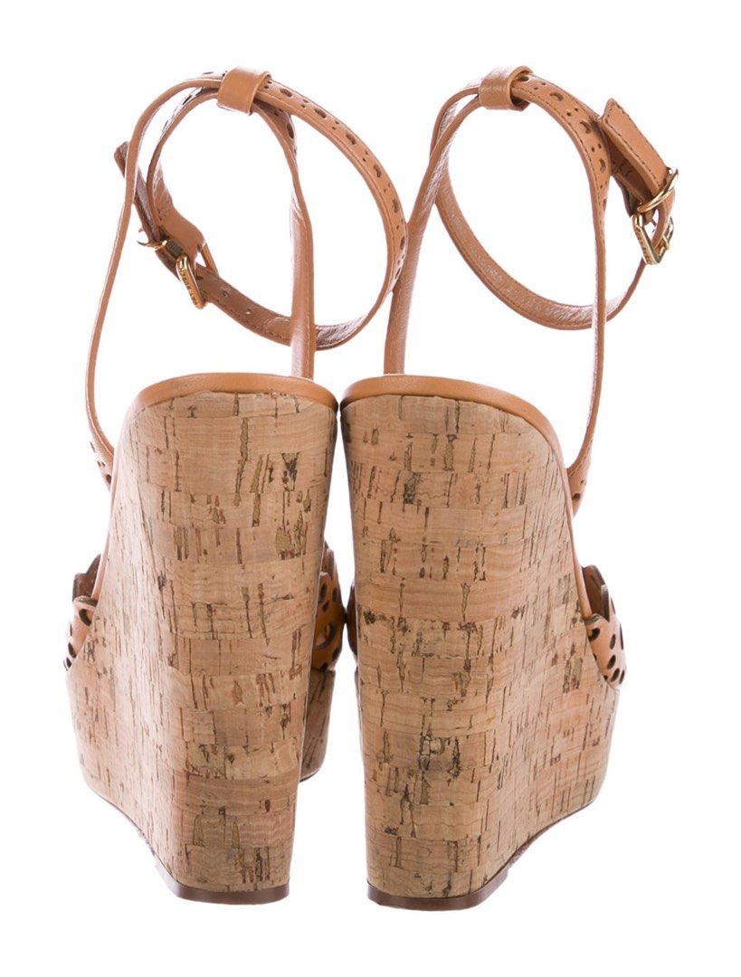 Camel leather Tory Burch Verity Wedges (Category: Wedges) located in Quezon City. Submitted by dresscrumbs (Listing ID 1470045672, Image 2). Description: Camel leather Tory Burch Verity wedges with round toes, perforated detail throughout, cork covered heels and buckle closure at ankles. - Includes box - Soles has some wear - it’s approx 25.5cm Contact us on W.A for product videos .