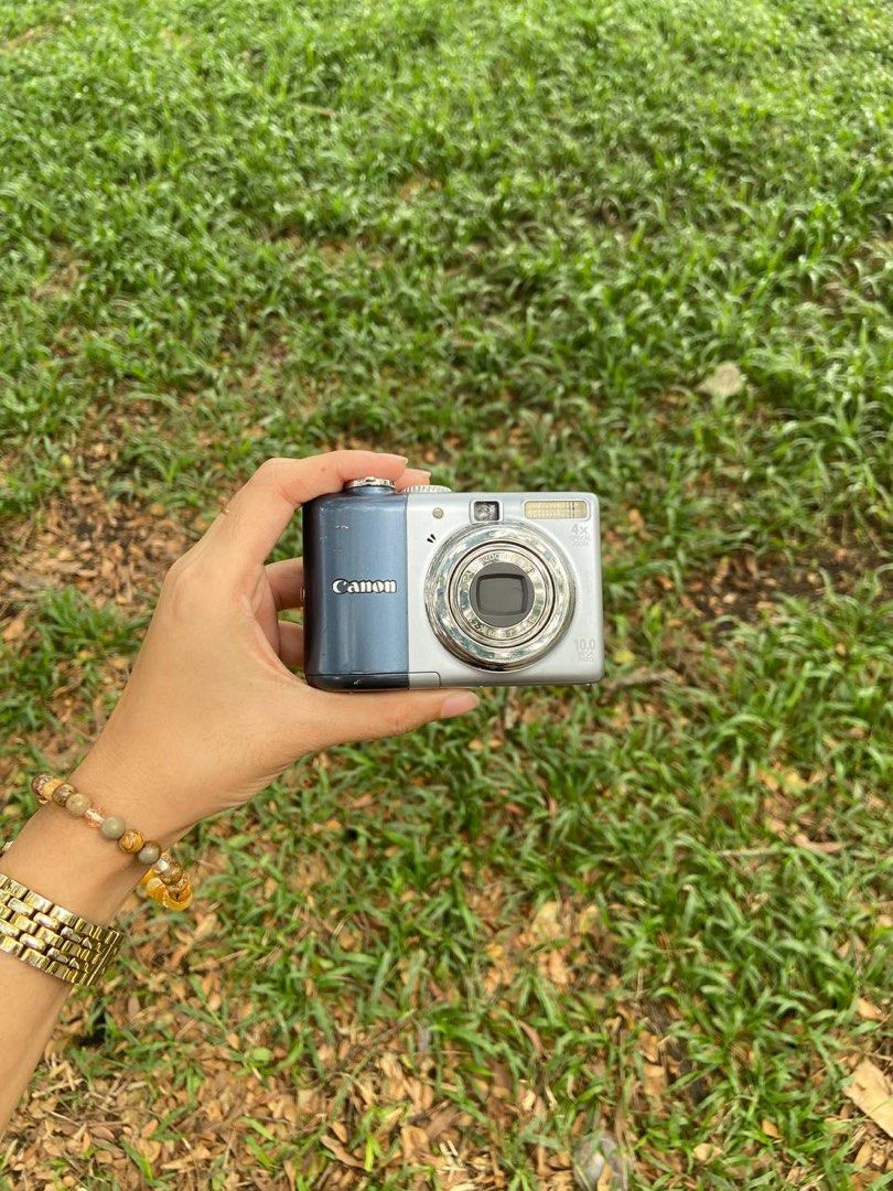 Canon digital camera 10.0 megapixels 4x optical zoom (Category: Cameras) located in Davao. Submitted by nnnnnaaaamt (Listing ID 1470076435, Image 1). Description: - Model: Canon powershot A1000is compact digital camera - Resolution: 10.0 megapixels - Flash: Built-in flash on top right - Portability: Compact size that fits comfortably in your hand - Best for: Everyday snapshots and travel.