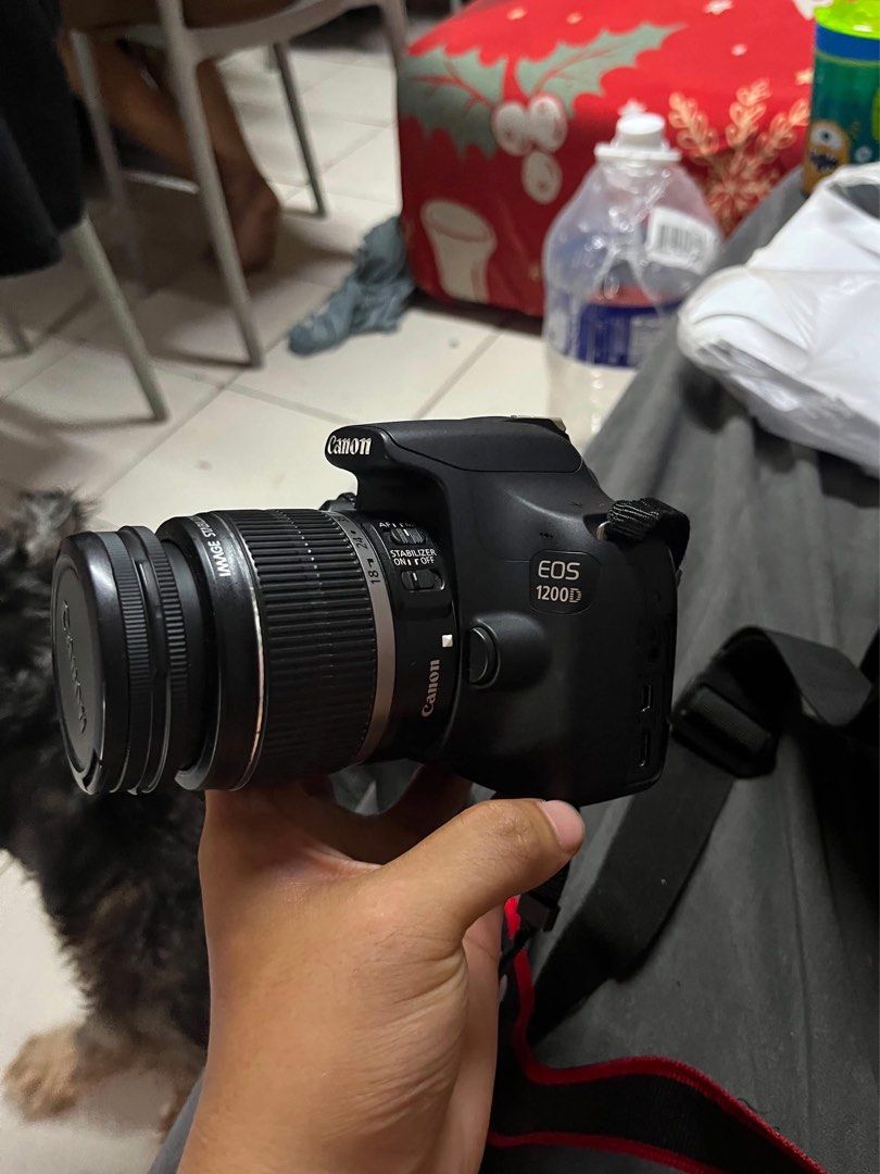 Canon EOS 1200D DSLR Camera with 18-55mm Lens (Category: Cameras) located in Taguig. Submitted by jhnphi (Listing ID 1470098966, Image 2). Description: - Model: Canon EOS 1200D DSLR Camera Body (Black) - Lens: 18-55mm Image Stabilizer (IS) Lens - Included Accessories: Standard neck strap and lens cap, battery, and charger - Condition: good working condition, standard buttons, and vignette LCD screen - Ideal for: Aspiring photographers and hobbyis