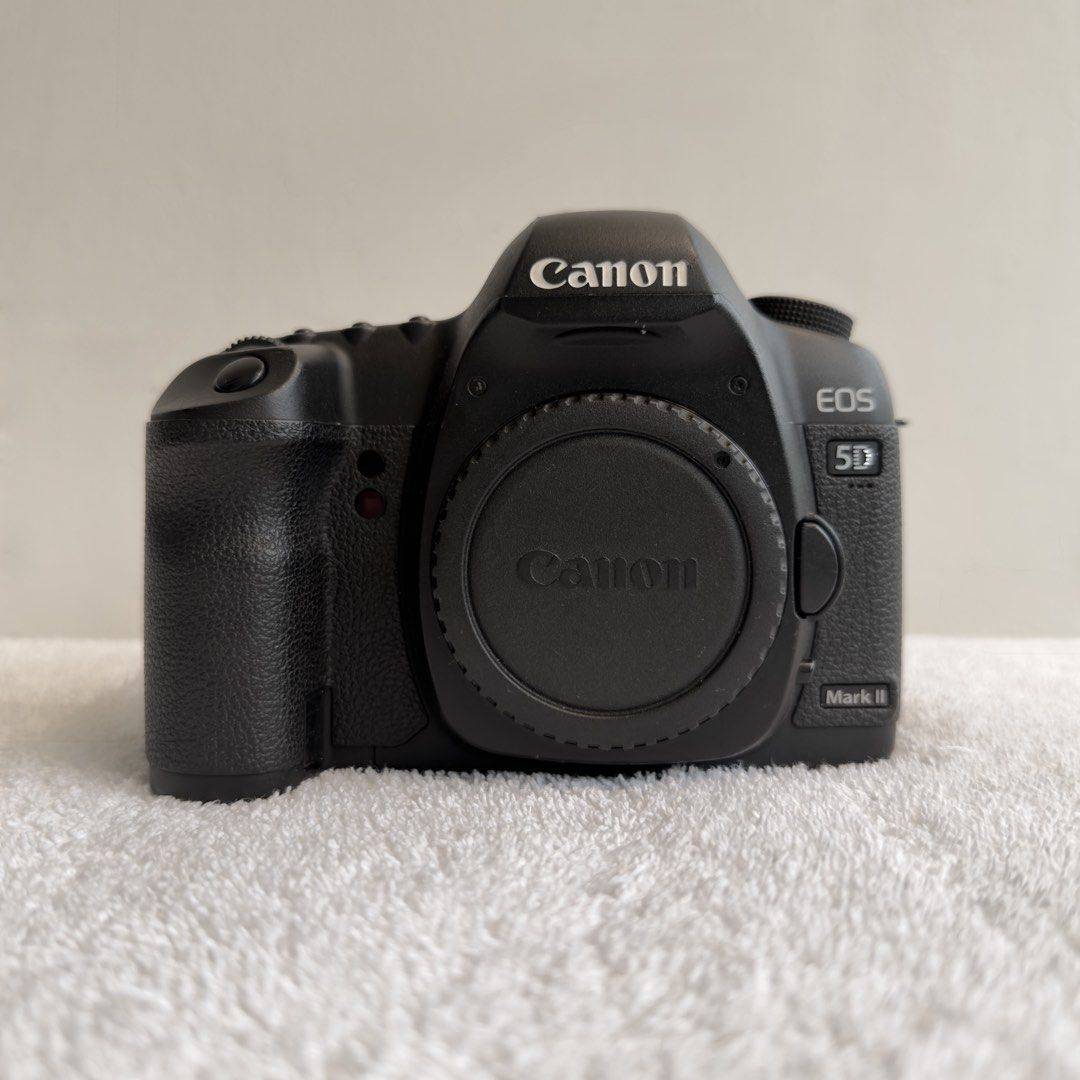 Canon EOS 5D Mark II (Category: Cameras) located in Dasmarinas. Submitted by fromyclosettt (Listing ID 1470135595, Image 1). Description: Canon EOS 5D Mark II | Full-Frame DSLR A classic full-frame camera for portraits, events, landscapes, and professional photography. Specifications • 21.1MP Full-Frame CMOS Sensor • DIGIC 4 Image Processor • ISO 100–6400 (expandable to 25,600) • Full HD 1080p Video Recording • 9-point Autofocus System • Durable 