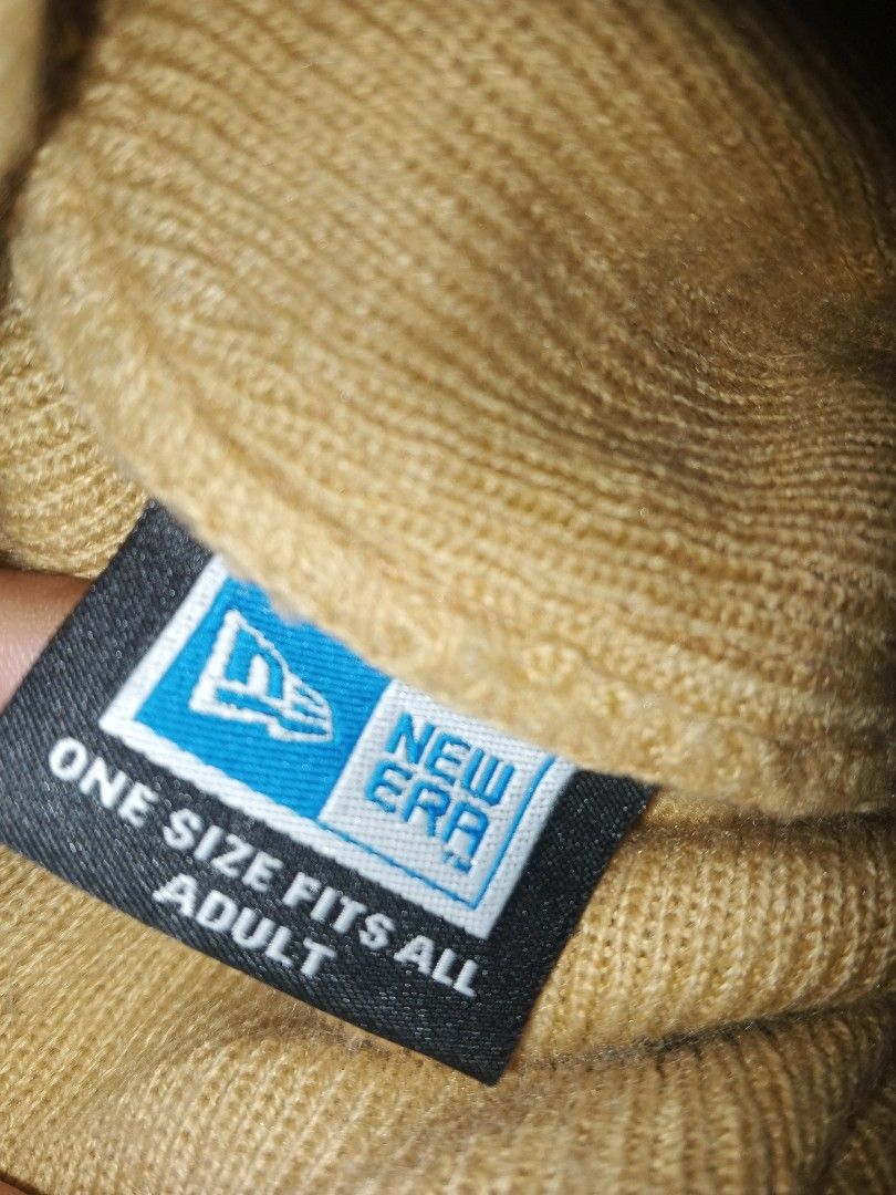 Cap Y2K (Category: Announcements) located in Manila. Submitted by icamalicdem29 (Listing ID 1470037166, Image 3). Description: beige or tan knitted brimless or visored beanie/work cap featuring an embroidered "A" logo (resembling the Atlanta Braves or a similar athletic team) and a New Era logo on the side..
