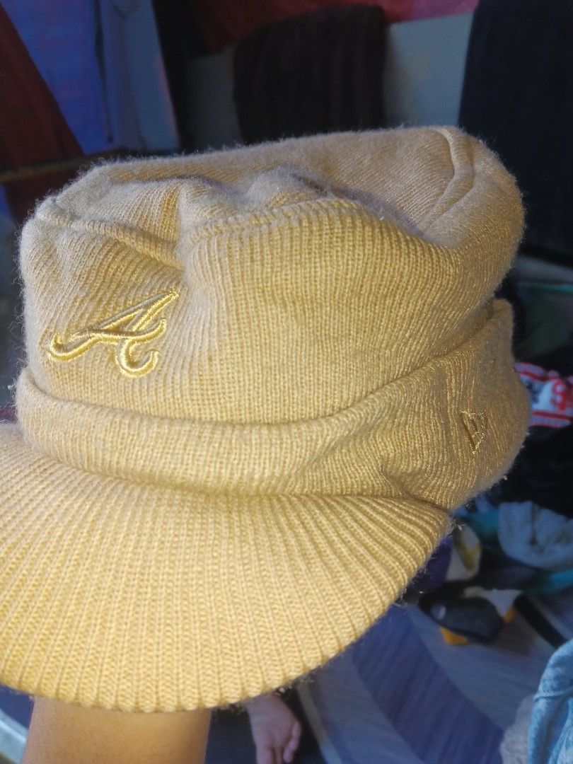 Cap Y2K (Category: Announcements) located in Manila. Submitted by icamalicdem29 (Listing ID 1470037166, Image 1). Description: beige or tan knitted brimless or visored beanie/work cap featuring an embroidered "A" logo (resembling the Atlanta Braves or a similar athletic team) and a New Era logo on the side..