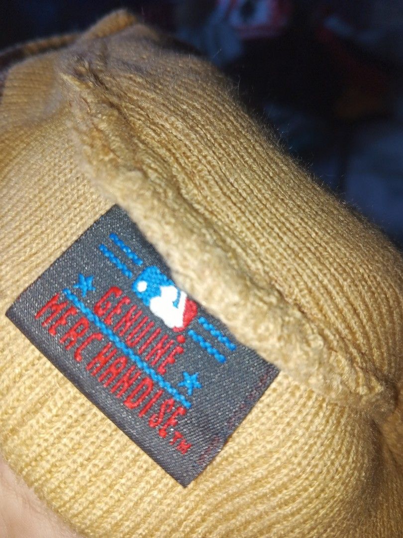 Cap Y2K (Category: Announcements) located in Manila. Submitted by icamalicdem29 (Listing ID 1470037166, Image 2). Description: beige or tan knitted brimless or visored beanie/work cap featuring an embroidered "A" logo (resembling the Atlanta Braves or a similar athletic team) and a New Era logo on the side..