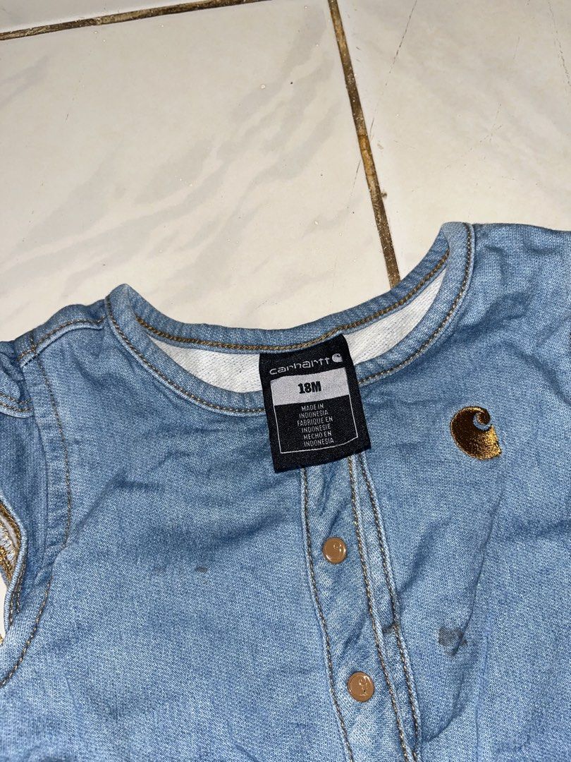 Carhartt Denim Baby Romper (Category: Babies & Kids Fashion) located in Nabua. Submitted by lastthrift2.0 (Listing ID 1469989491, Image 3). Description: Pang baby girl niyo🥰 - Brand: Carhartt - Item: Denim baby romper - Color: Blue - Size: 18M (Tag attached) - Material: 91% cotton, 8% polyester, 1% elastane (Made in Indonesia) - Features: Ruffle shoulders, front placket and bottom snap closures, two back patch pockets with Carhartt logo patch - 