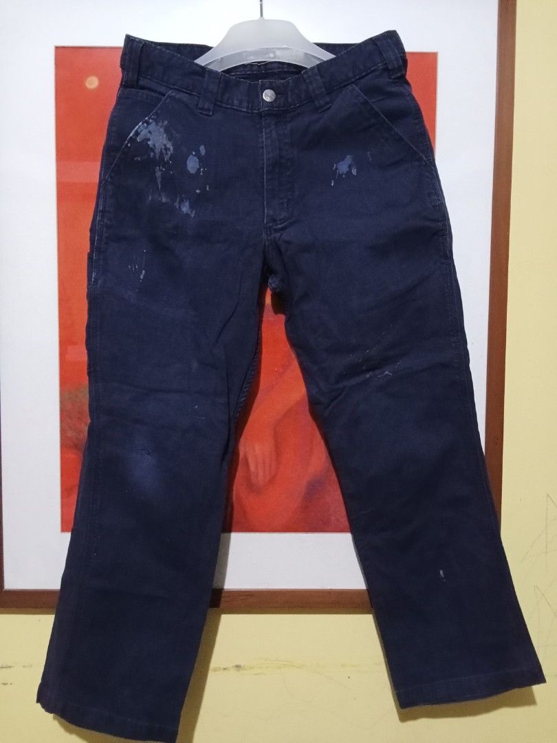 Carhartt Navy Blue Work Pants Cargo Utility (Category: Jeans) located in Manila. Submitted by okellorrai95403 (Listing ID 1470087533, Image 2). Description: - Brand: Carhartt - Color: Navy blue - Material: Heavy-duty durable canvas - Fit: Classic utility fit - Features: Multiple pockets, branded metal button closure - Condition: Pre-loved with authentic paint splatters on the front right pocket and a small tear on the left leg - Ideal for: Workwe