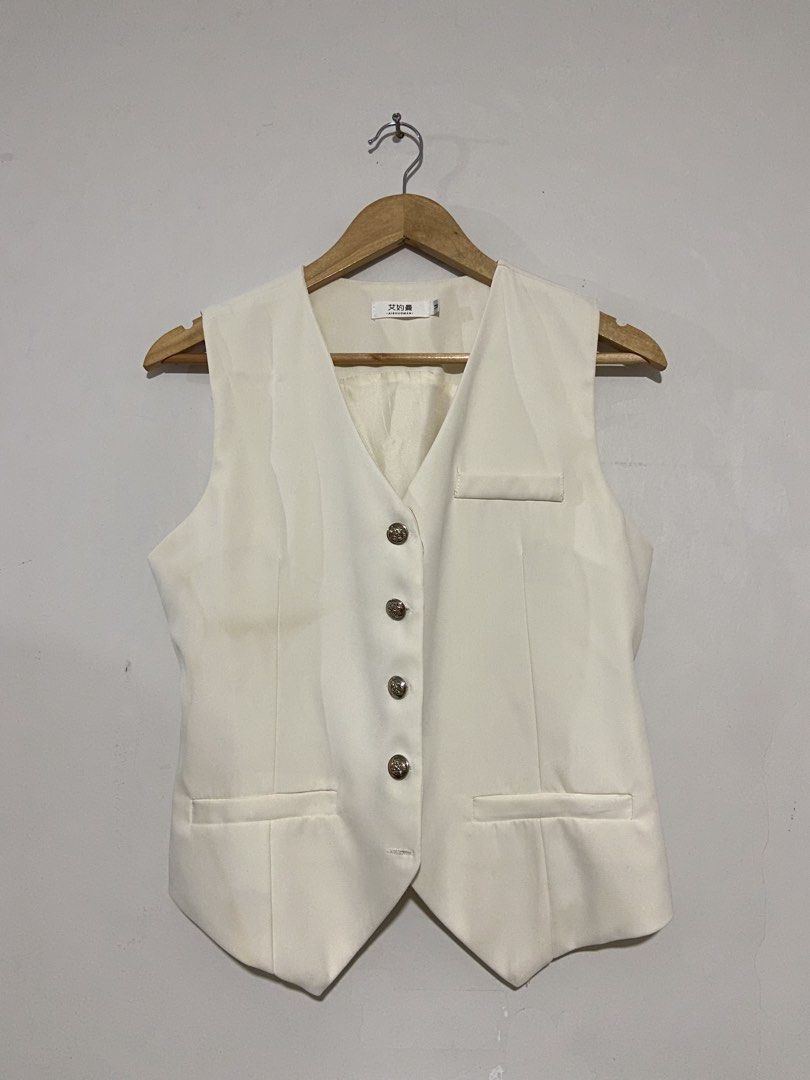 Carine vest waistcoat (Category: Sleeveless) located in Lapu-Lapu City. Submitted by denyella (Listing ID 1469964231, Image 1). Description: Carine vest with adjustable strap color: white size: M (53-58kg) used thrice only - has visible stain on the front part rfs: lost weight, no longer fits me.