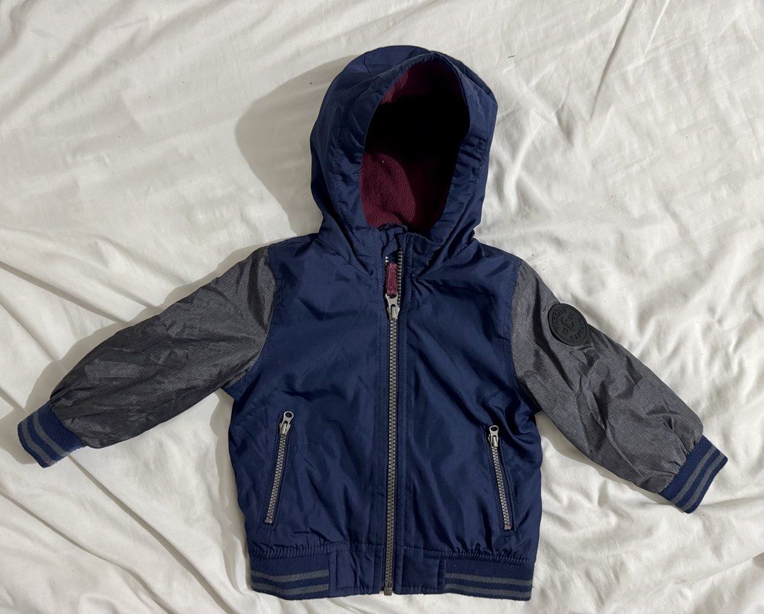 Baby Jacket (Category: Babies & Kids Fashion) located in Paranaque City. Submitted by april_anythingpreloved (Listing ID 1470084577, Image 1). Description: - Brand: Carter's - Size on tag: 12 Months - Color: Deep navy blue exterior with cozy maroon fleece lining and hood - Closure: Front zipper - Features: Interior tag for name and phone number - Condition: Great piece for cold weather - Bought in the US -RFS: Decluttering.