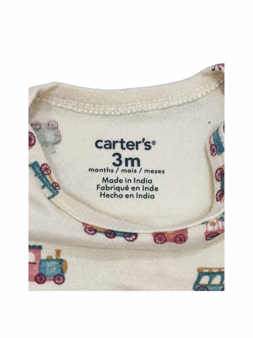 Carter’s Onesie (3M) (Category: Babies & Kids Fashion) located in Angeles City. Submitted by aeapreloved (Listing ID 1470057466, Image 2). Description: Carter’s Baby Onesie 🚂 Cream-colored short-sleeve onesie with cute vintage train prints. Soft and comfy for everyday wear. • Brand: Carter’s • Size: 3 months • Snap-button closure at the bottom • Cute and colorful train design .