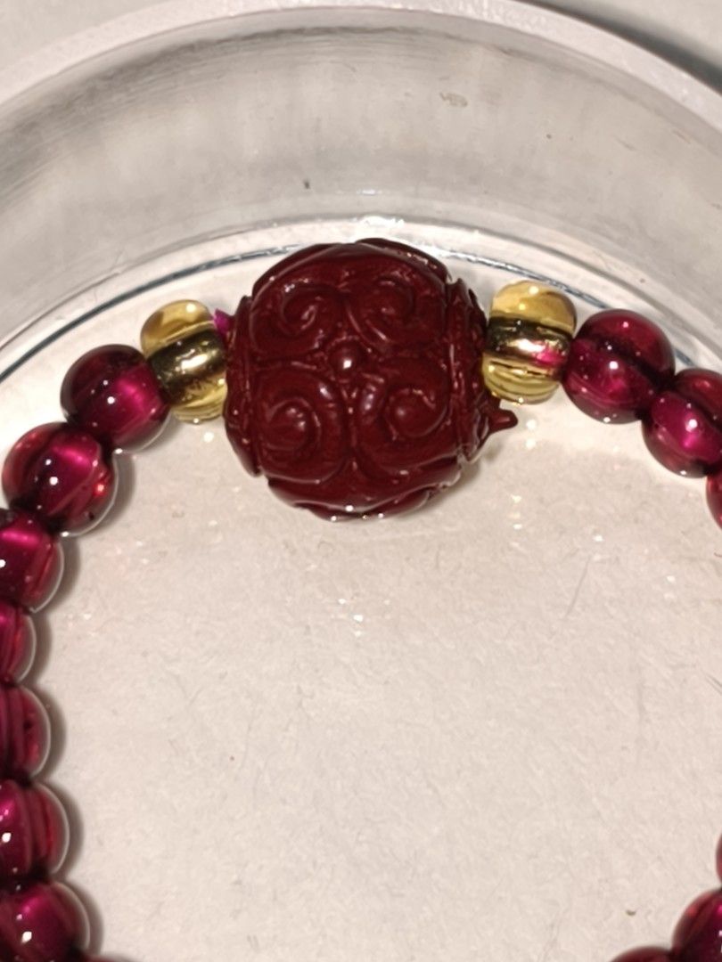 Carved cinnabar with natural wine red garnet string beaded ring. (Category: Bracelets) located in Caloocan City. Submitted by books_and_beads (Listing ID 1470087409, Image 2). Description: - Deep red beaded stretch bracelet - Vintage-inspired elegance. ✨ A beautifully carved, deep crimson Cinnabar focal bead paired with a stretchy band of lustrous, wine-red Garnet. The pop of gold spacers gives it such a rich, luxurious feel. Perfect for adding a