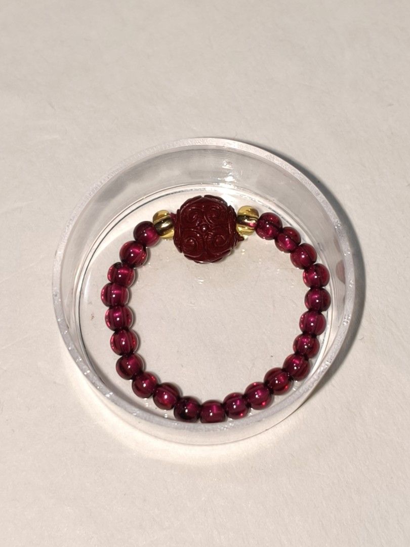 Carved cinnabar with natural wine red garnet string beaded ring. (Category: Bracelets) located in Caloocan City. Submitted by books_and_beads (Listing ID 1470087409, Image 1). Description: - Deep red beaded stretch bracelet - Vintage-inspired elegance. ✨ A beautifully carved, deep crimson Cinnabar focal bead paired with a stretchy band of lustrous, wine-red Garnet. The pop of gold spacers gives it such a rich, luxurious feel. Perfect for adding a