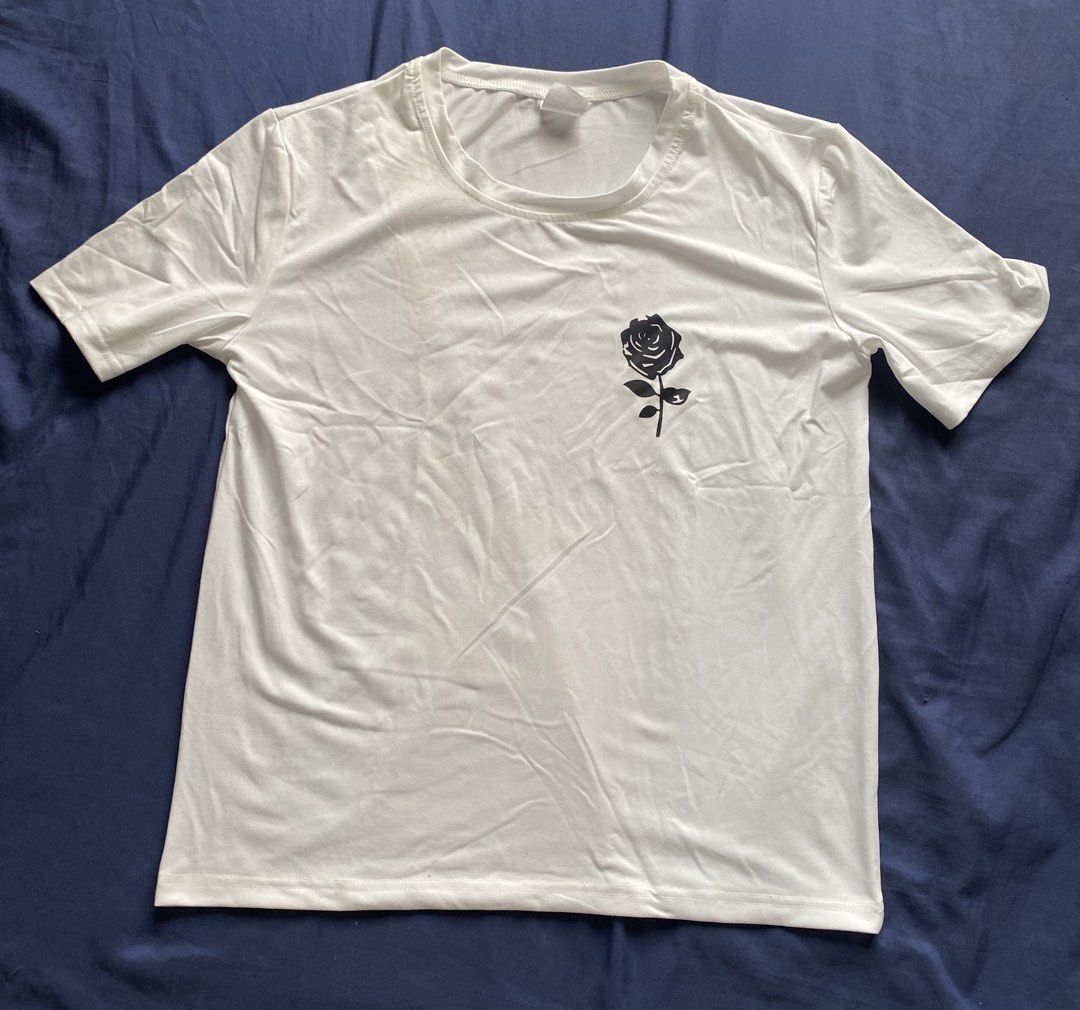 Casual Graphic Print T-shirts Bundle / Individual (Category: Shirts) located in Manila. Submitted by livebear-e9f3 (Listing ID 1470017784, Image 2). Description: - Set of 4 casual crewneck t-shirts made from a soft cotton blend - Olive green tee with 'New York USA' print - White tee featuring a black rose design on the chest - Black jersey-style tee with 'Rocknrolla 23' and white stripes - Pink and black colorblock top with 'New York 1968' letter