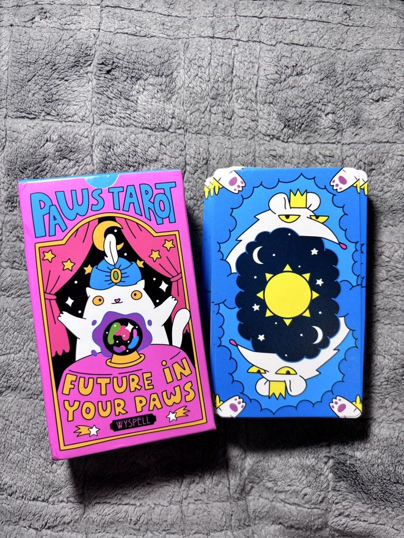Cat Paws Tarot Deck by Wyspell (Category: Storybooks) located in Mandaluyong City. Submitted by ryoonii (Listing ID 1470058506, Image 3). Description: 350 nalanggg 😻💗 super cute quirky illustrations! great gift idea for cat lovers, pwede rin for fun use and pang display (description below from Wyspell product page) • Unique Cat Tarot Deck: Hand-drawn cat illustrations integrated with traditional tarot symbolism, capturing the essence of each cl