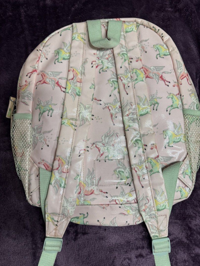Cath Kids London Unicorn Pink Backpack (Category: Backpacks) located in Valenzuela. Submitted by sofiasticated.decluttering (Listing ID 1470069681, Image 2). Description: - Brand: Cath Kidston Kids - Design: Pink with all-over winged unicorn print - Storage: Main compartment, front zip pocket with cute wing pull, and dual mesh side pockets - Comfort: Adjustable shoulder straps and top hanging loop - Interior: Pink lining with a convenient slip po