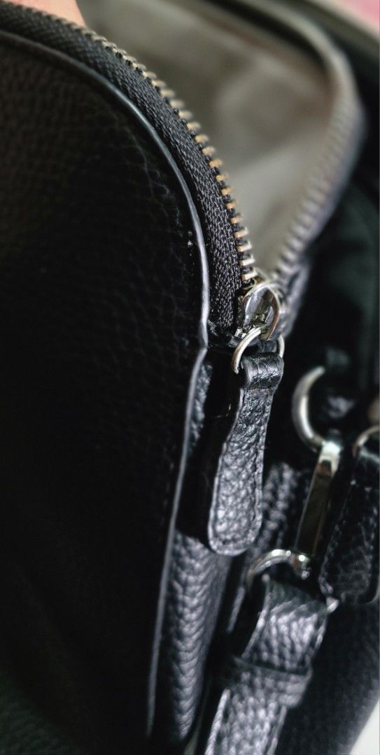 Catwalk Black Textured Handbag with Shoulder Strap (Category: Shoulder Bags) located in Manila. Submitted by ubasirene (Listing ID 1470083487, Image 3). Description: - Brand: Catwalk fromm sweden - Material: Black faux leather with textured pebble finish - Hardware: Sleek silver-tone zippers and rings - Carry Options: Dual top handles + adjustable, detachable shoulder strap - Closure: Secure top zip closure - Interior: Clean lining with multiple 